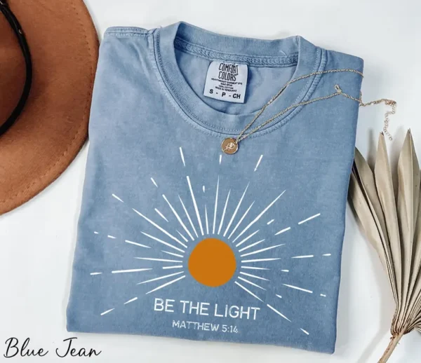 Blue Jean Ladies Christian T-Shirt – Be the Light Matthew 5:14 Sunburst Design